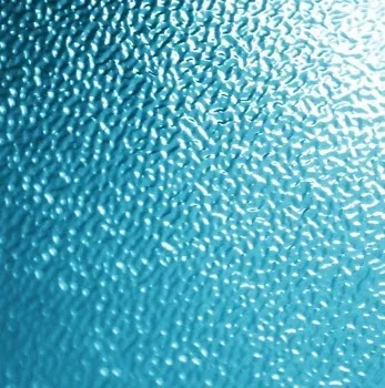 Textured blue glass surface with a rippled pattern.